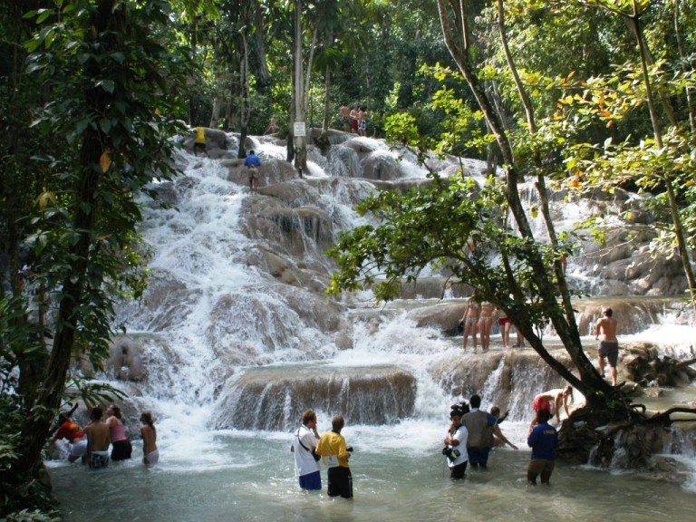 Guests climbing the terraced cascades of Dunn's River Falls, not photographed at the villa