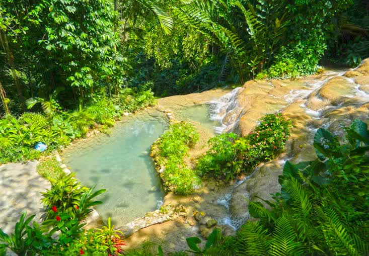 Terraced rock pools and tropical gardens at Konoko Falls, not photographed at the villa